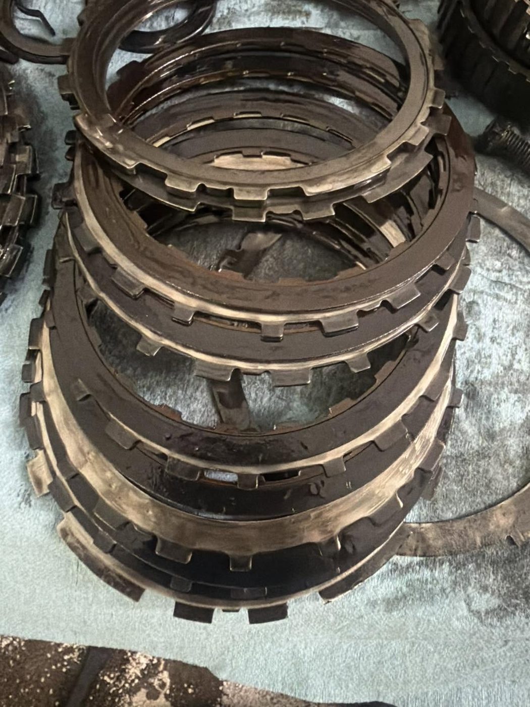 A stack of transmission clutch pack frictions