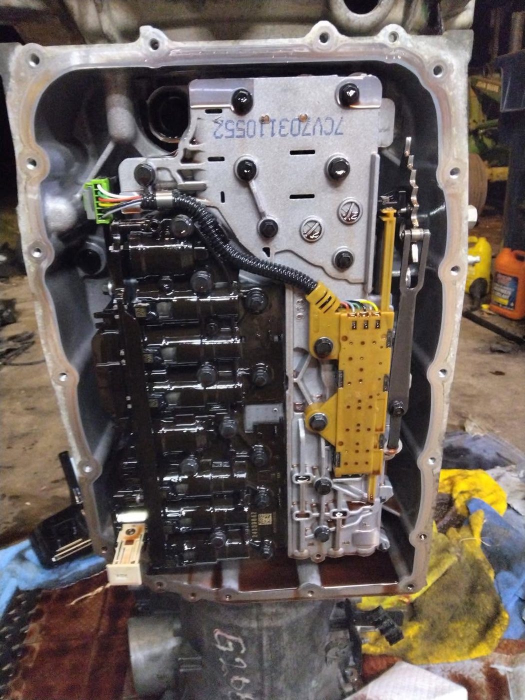 A transmission valve body opened up on the bench at KND Performance
